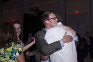 This is a photo of me and my Dad hugging as they called my name for the 2012 World Championship of Public Speaking. He whispered in my ear "That was the best $60 I have ever spent!"